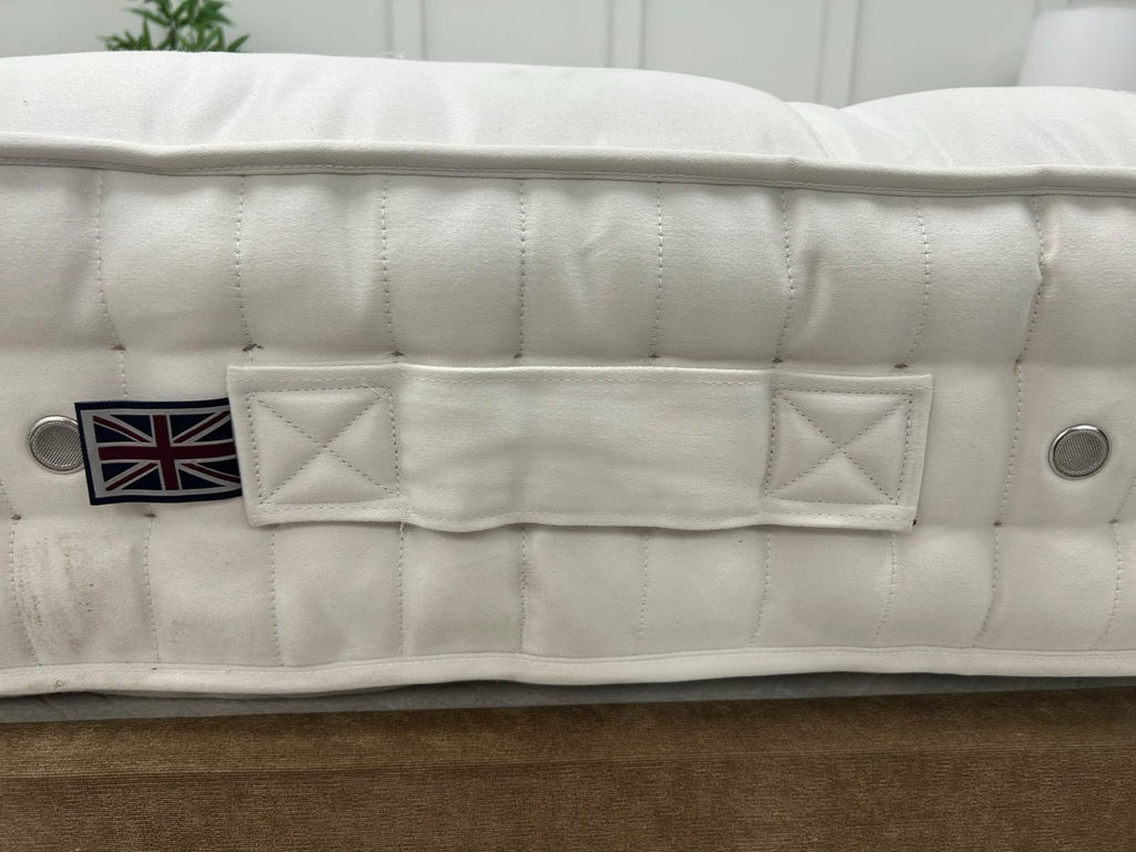 Vispring Baronet Superb 5FT Kingsize mattress with firm spring support, shown in a bedroom setting with bedding and pillows.