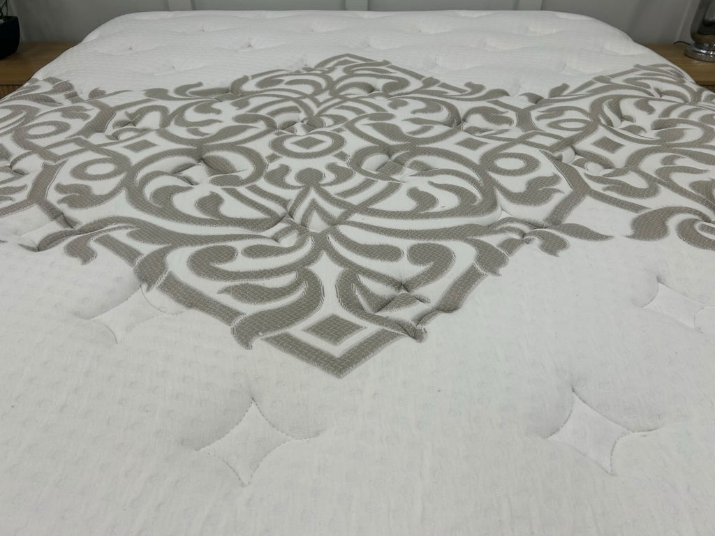 Igel Advance 2500 5ft Kingsize medium mattress with plush surface and supportive structure, shown in a bedroom setting.