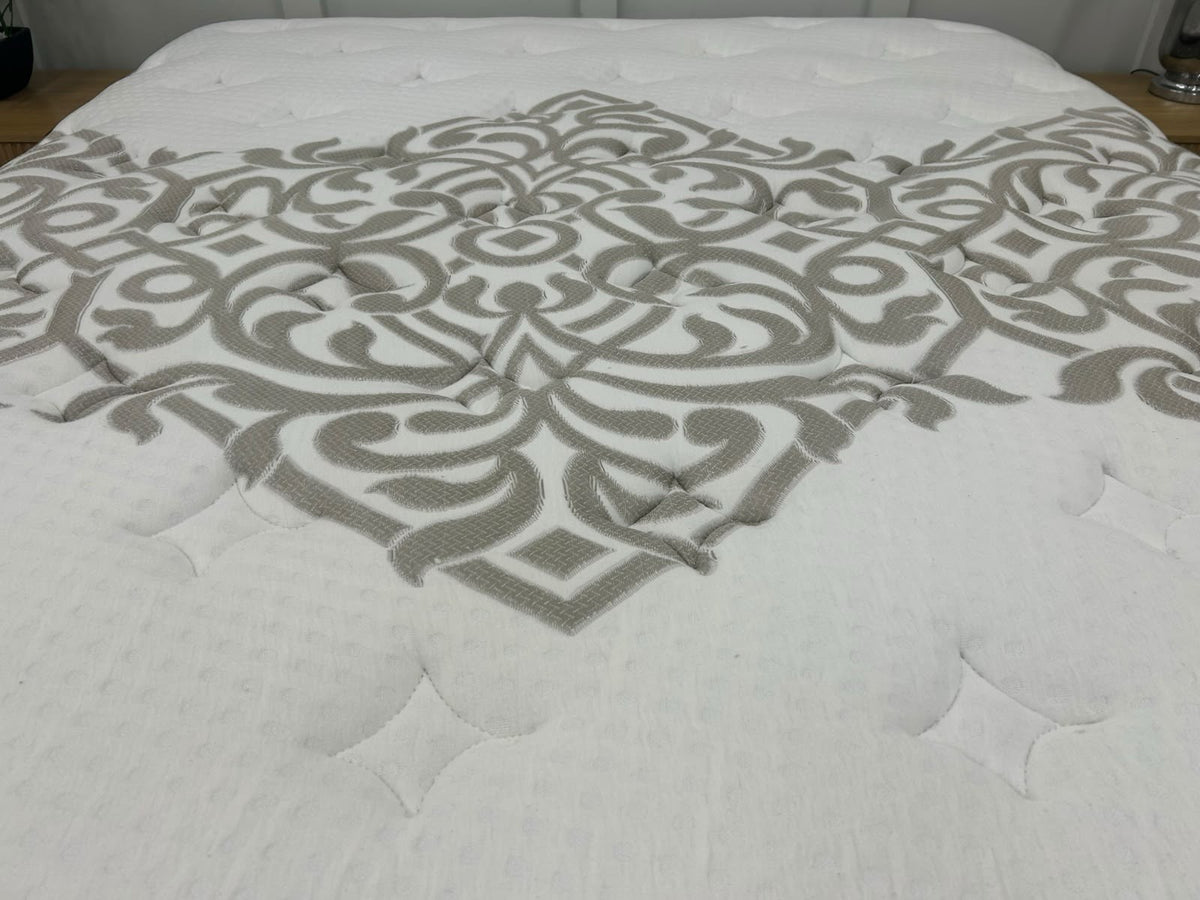 Igel Advance 2500 5ft Kingsize medium mattress with plush surface and supportive structure, shown in a bedroom setting.