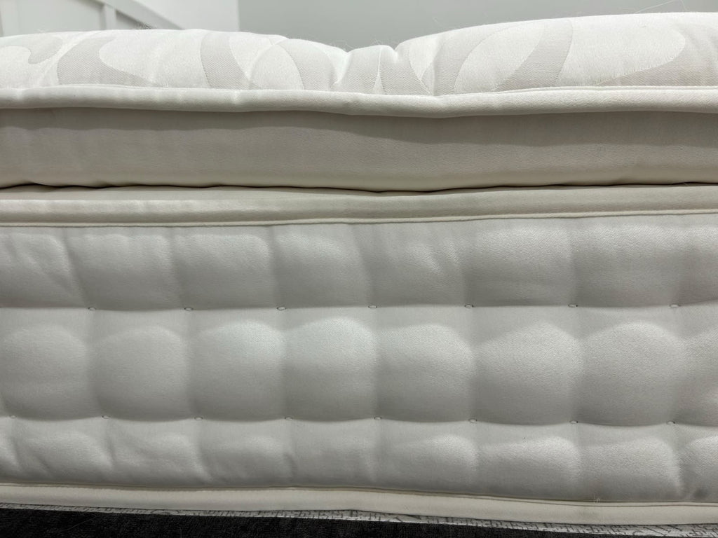 Staples and Co Artisan Pure Decadence 5FT Kingsize mattress with plush fabric and tufted top, showcasing its luxurious design.