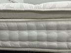 Staples and Co Artisan Pure Decadence 5FT Kingsize mattress with plush fabric and tufted top, showcasing its luxurious design.