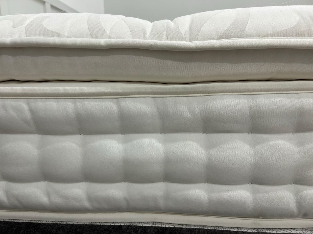 Staples and Co Artisan Pure Decadence 5FT Kingsize mattress with plush fabric and tufted top, showcasing its luxurious design.