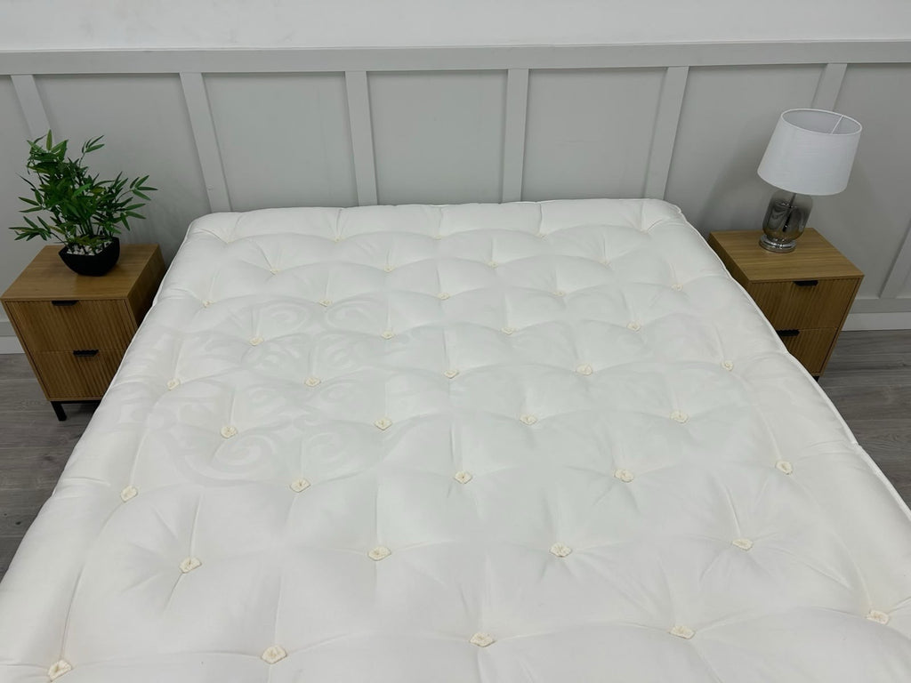 Staples Staples and Co Artisan Pure Decadence 5FT Kingsize mattress with plush fabric and detailed stitching, shown on bed frame.