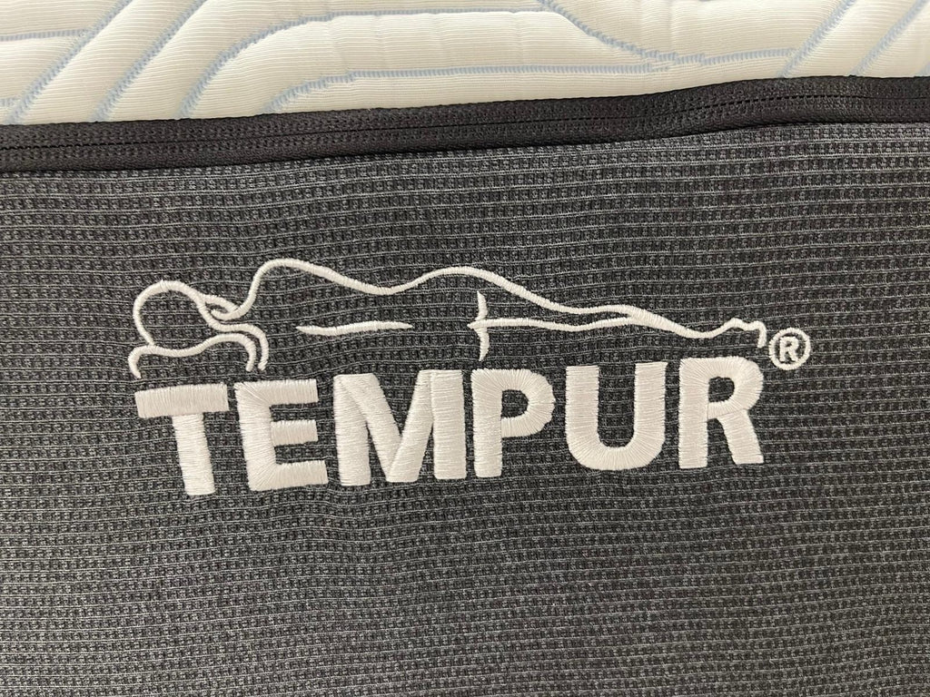 Tempur Pro Plus SmartCool Soft 4FT 6 double mattress with plush surface, white fabric cover, and side panels for support.