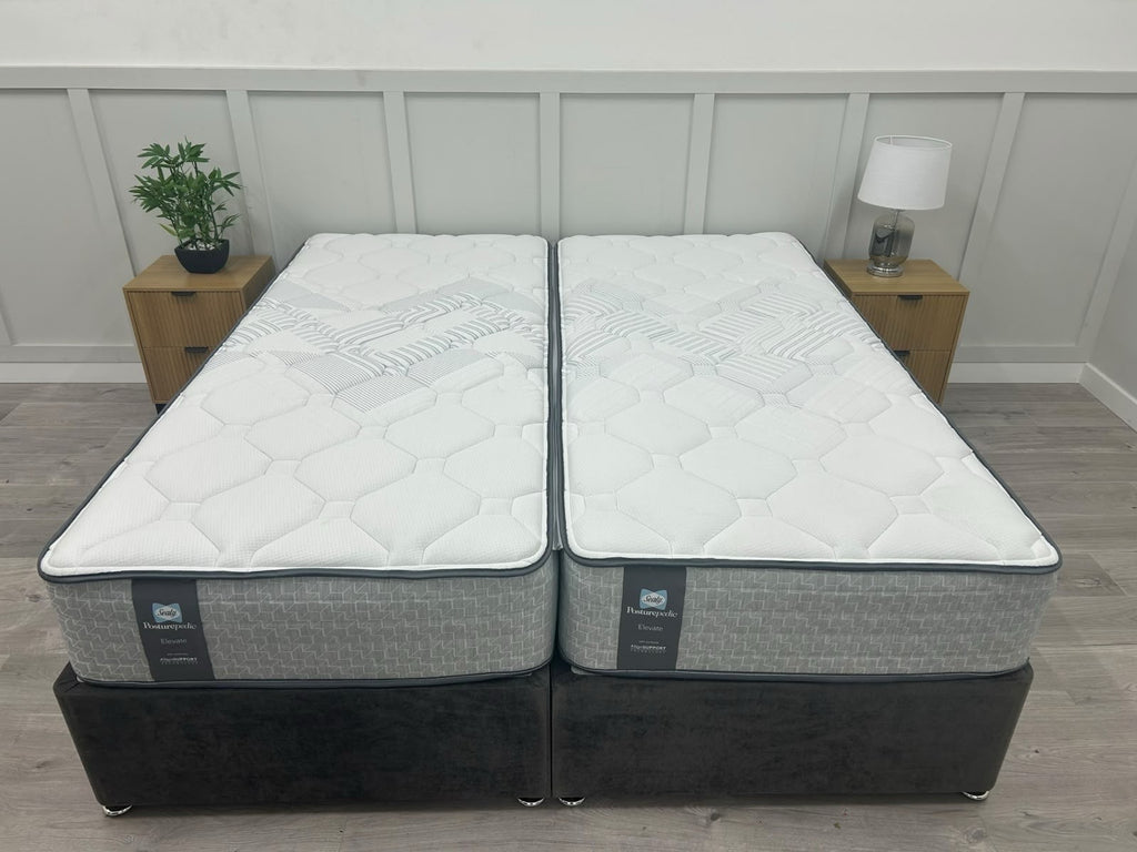 Sealy Newton 6FT Super King zip and link firm mattress with white fabric cover and plush surface, designed for comfort and support.