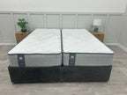 Sealy Newton 6ft Superking zip and link firm mattress with plush fabric cover, designed for comfort and support in a spacious bed frame.