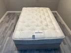 Harrison Spinks 2750 Ely Ortho 4FT 6 double mattress with firm support, showing plush fabric and bed setup.