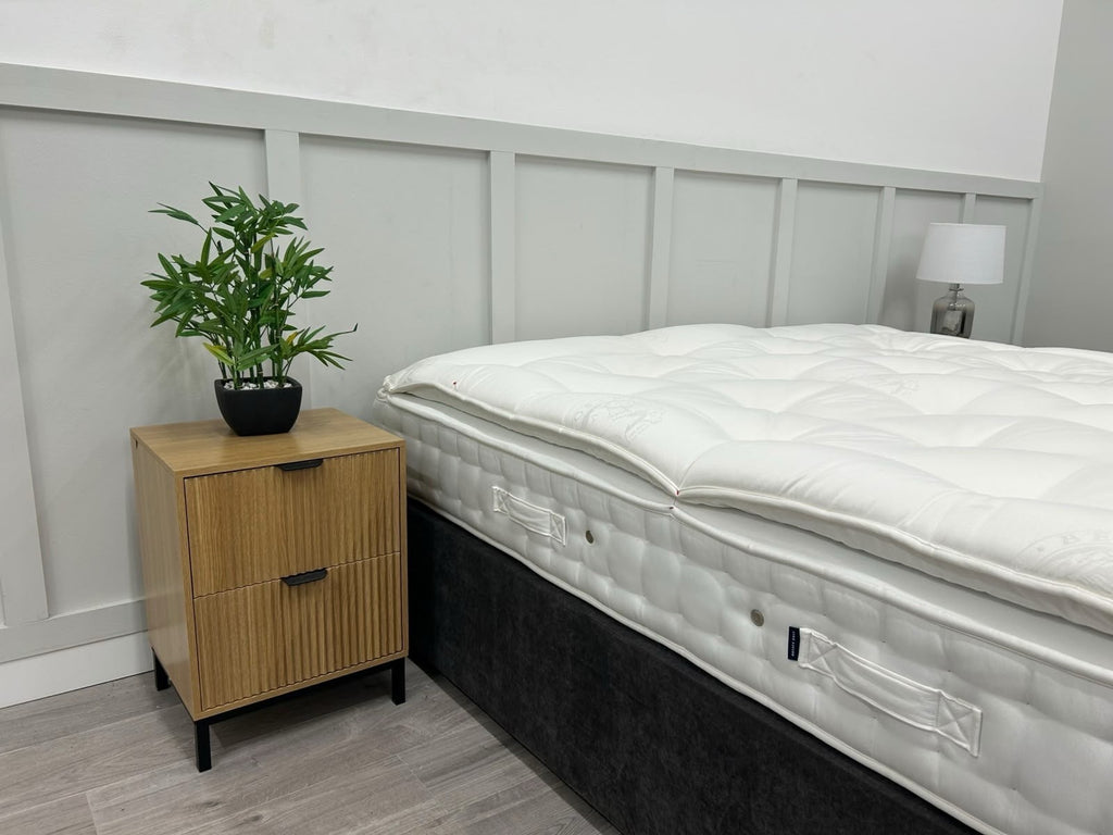 Hypnos bespoke opal pillowtop mattress in 6ft super king size with a firm surface, showcasing plush fabric and mattress edges.
