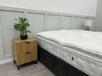 Hypnos bespoke opal pillowtop mattress in 6ft super king size with a firm surface, showcasing plush fabric and mattress edges.