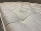 Harrison Spinks 2750 Ely Ortho 4FT 6 double mattress with firm support, featuring plush fabric cover and detailed internal layers.