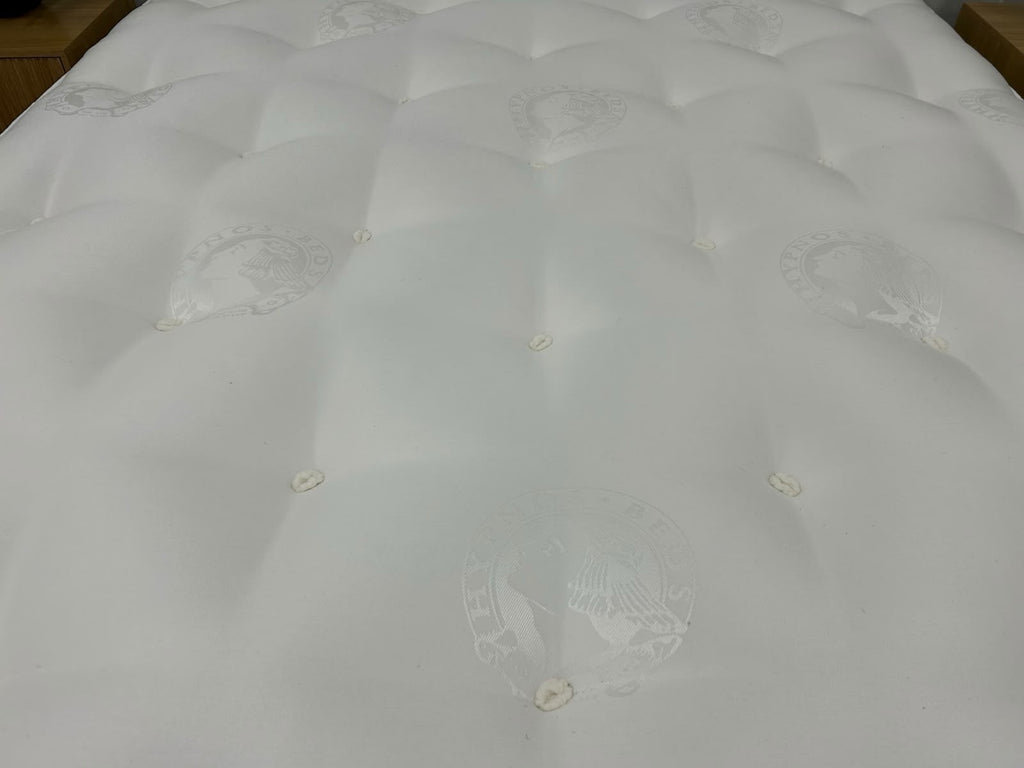 Hypnos Cawthorne Deluxe 5FT Kingsize medium mattress with plush fabric and quilted top, designed for comfort and support.