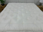 Staples and Co Artisan Pure Decadence 5FT Kingsize mattress with plush fabric and detailed stitching, showcasing its luxurious surface.