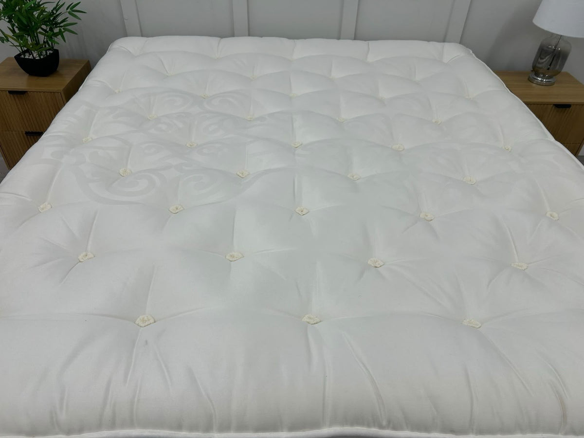 Staples and Co Artisan Pure Decadence 5FT Kingsize mattress with plush fabric and detailed stitching, showcasing its luxurious surface.