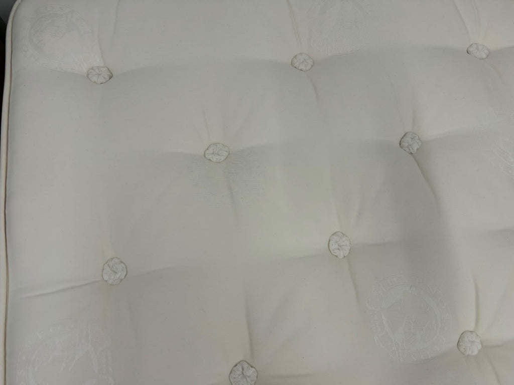 Hypnos Luxurious Earth 02 double mattress, 4ft 6, with plush fabric and supportive medium firmness, displayed on a bed frame.