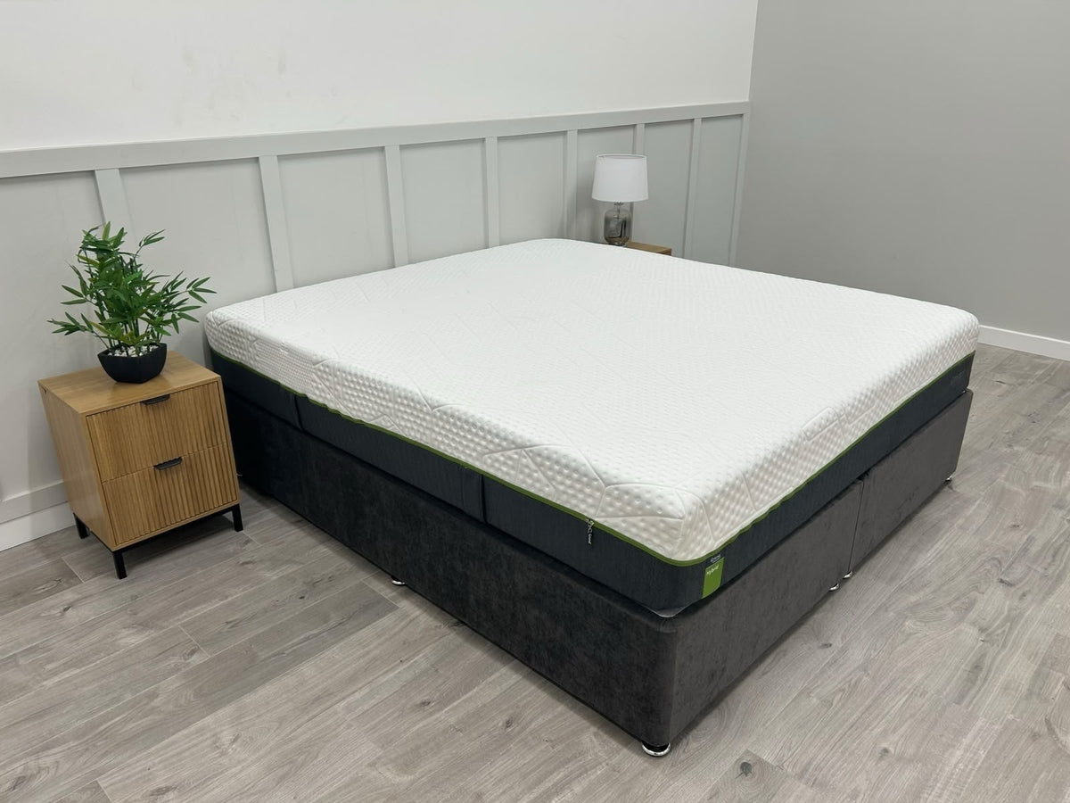 Emma Diamond Hybrid 6FT Superking mattress with medium firm support, shown on a bed with bedding and pillows.