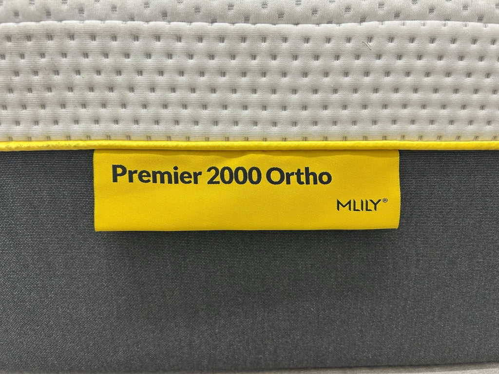 Mlily Premier 2000 Orthopedic Double Mattress in 4FT6 size, firm support, with a plush fabric cover, shown in a bedroom setting.