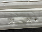 Staples Staples and Co Artisan Pure Decadence 5FT Kingsize mattress with plush top and supportive edges, shown in a bedroom setting.