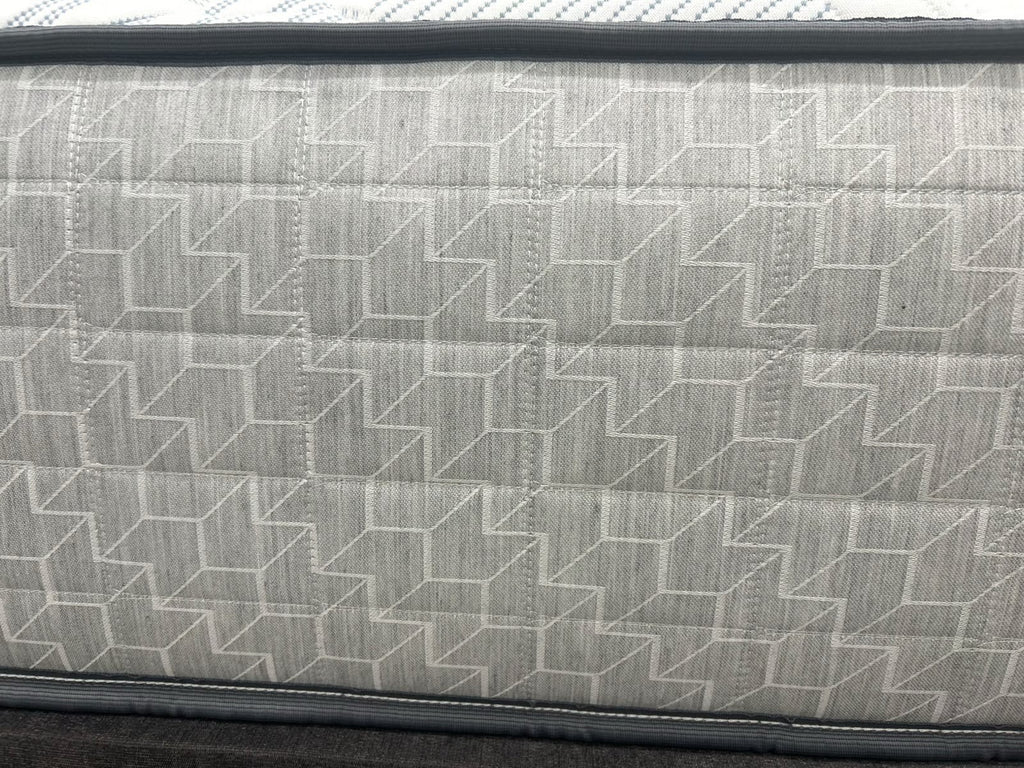 Sealy Newton 6FT Superking firm zip and link mattress with quilted surface and supportive design, shown on a bed frame.