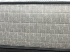Sealy Newton 6FT Superking firm zip and link mattress with quilted surface and supportive design, shown on a bed frame.