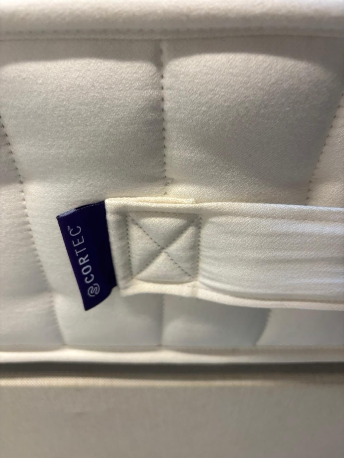 Harrison Spinks 2750 Ely Ortho 4FT 6 double mattress with firm support, featuring plush fabric cover and detailed stitching.