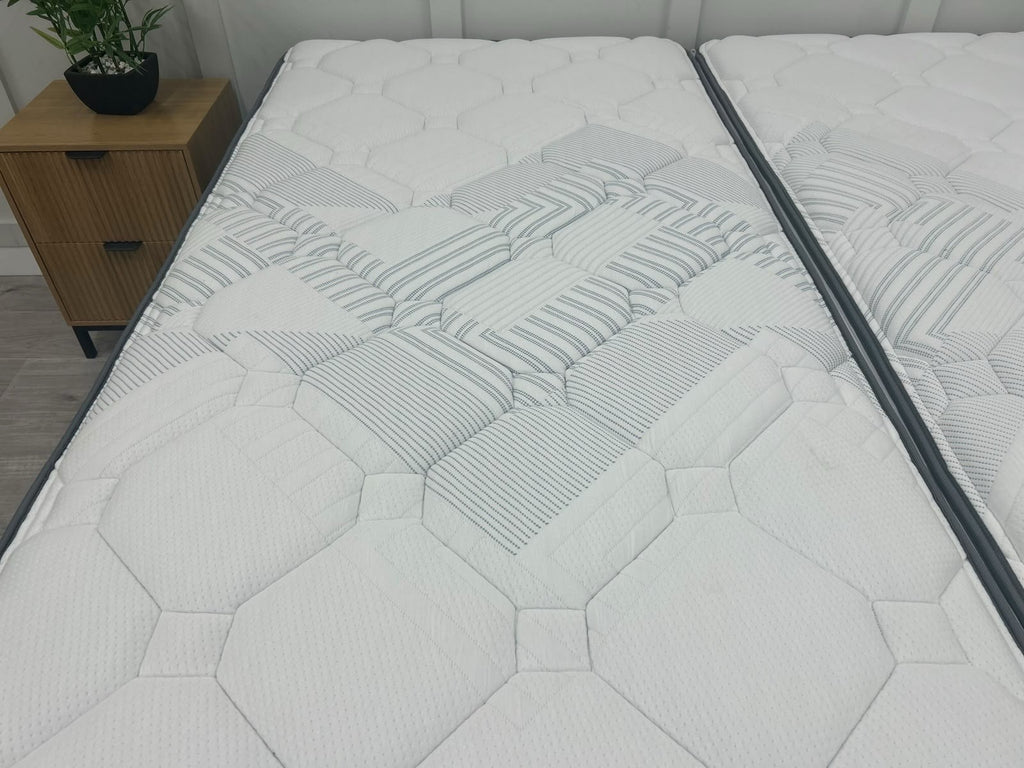 Sealy Newton 6FT Super King zip and link firm mattress with a plush fabric cover and visible stitching, designed for comfort and support.