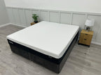 Tempur Pro Luxe Soft 6FT Superking mattress with plush surface, neatly made bed with white bedding and matching pillows.