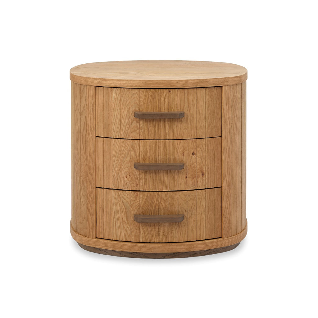 Weathered oak Bentley Designs bedside cabinet with three curved drawers, featuring a natural wood finish and elegant design.
