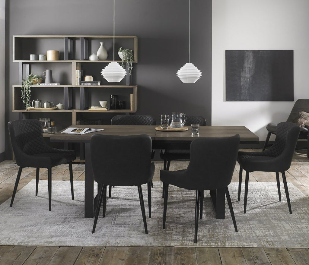 Weathered oak extending dining table with six grey leather chairs from Bentley Designs, stylish table and chair set for dining room.