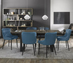 Weathered oak extending dining table with six blue velvet Bentley Designs chairs in a stylish table and chair set.