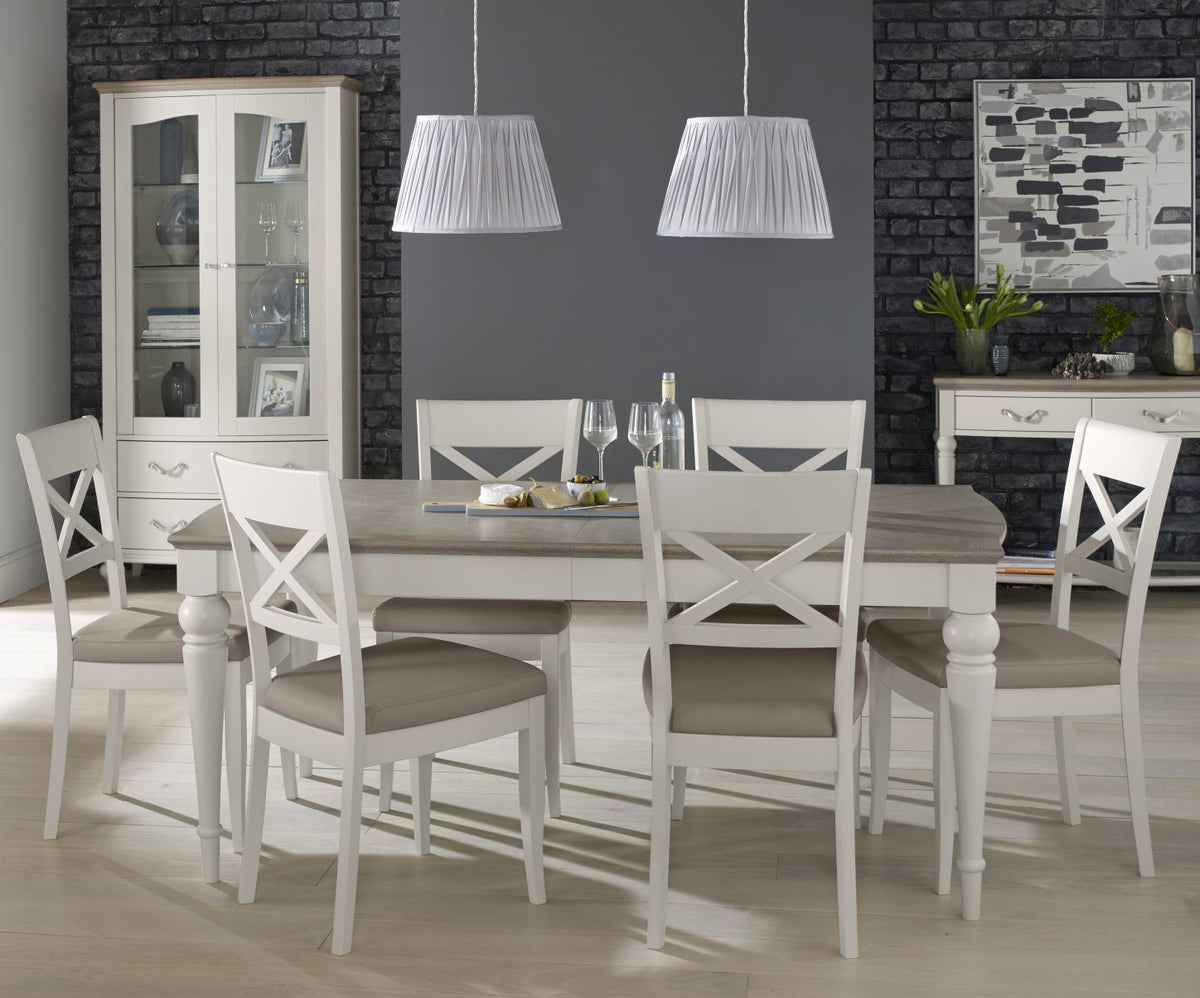 Washed oak top dining table with six grey leather chairs from Bentley Designs, modern table and chair set for dining room.
