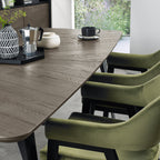 Weathered oak top extending dining table with black metal base, designed by Bentley Designs, showcasing its rustic and modern style.