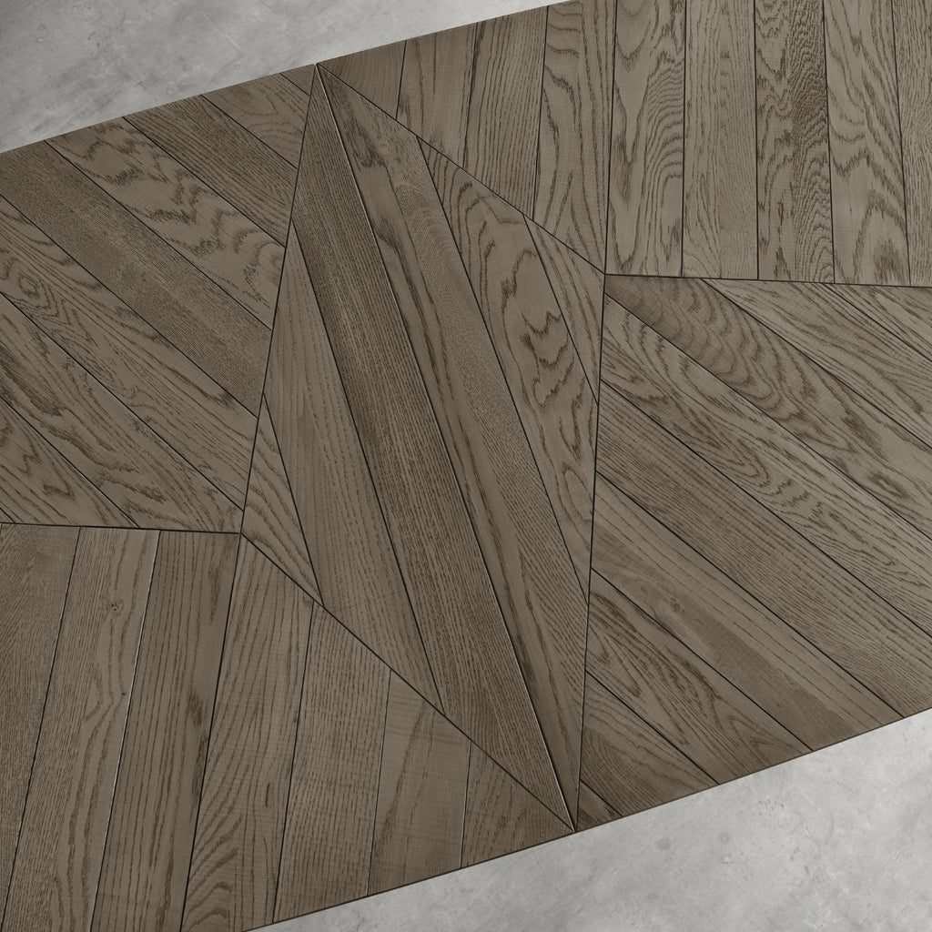 Weathered oak top extending dining table with black metal base, designed by Bentley Designs, showcasing its sturdy and stylish construction.