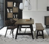 Weathered oak dining table set with two brown chairs and a small bench by Bentley Designs, showing the rustic table and seating.