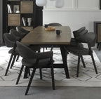Weathered Oak dining table with six grey fabric chairs and two carver chairs from Bentley Designs, showcasing a stylish table and chair set.