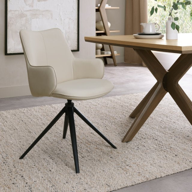 Ivory Leather Effect Swivel Dining Chair Black Legs