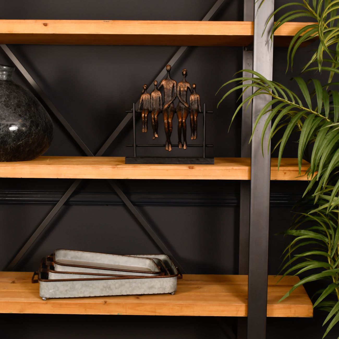 Family of 5 Sitting on Fence Sculpture