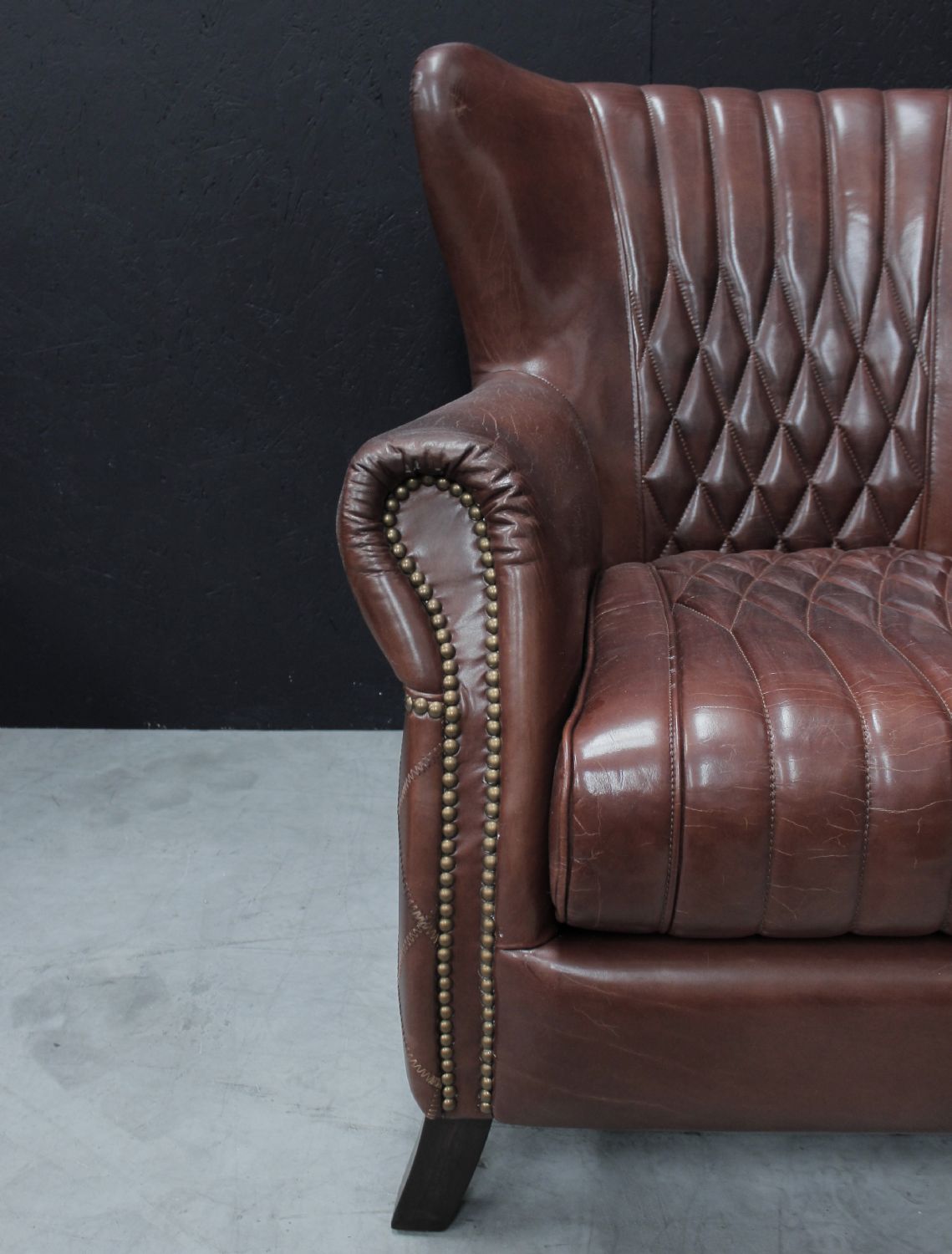 Vintage Brown Flared Back Leather Upholstered Armchair with Brass Detailing - Home Furniture Interiors