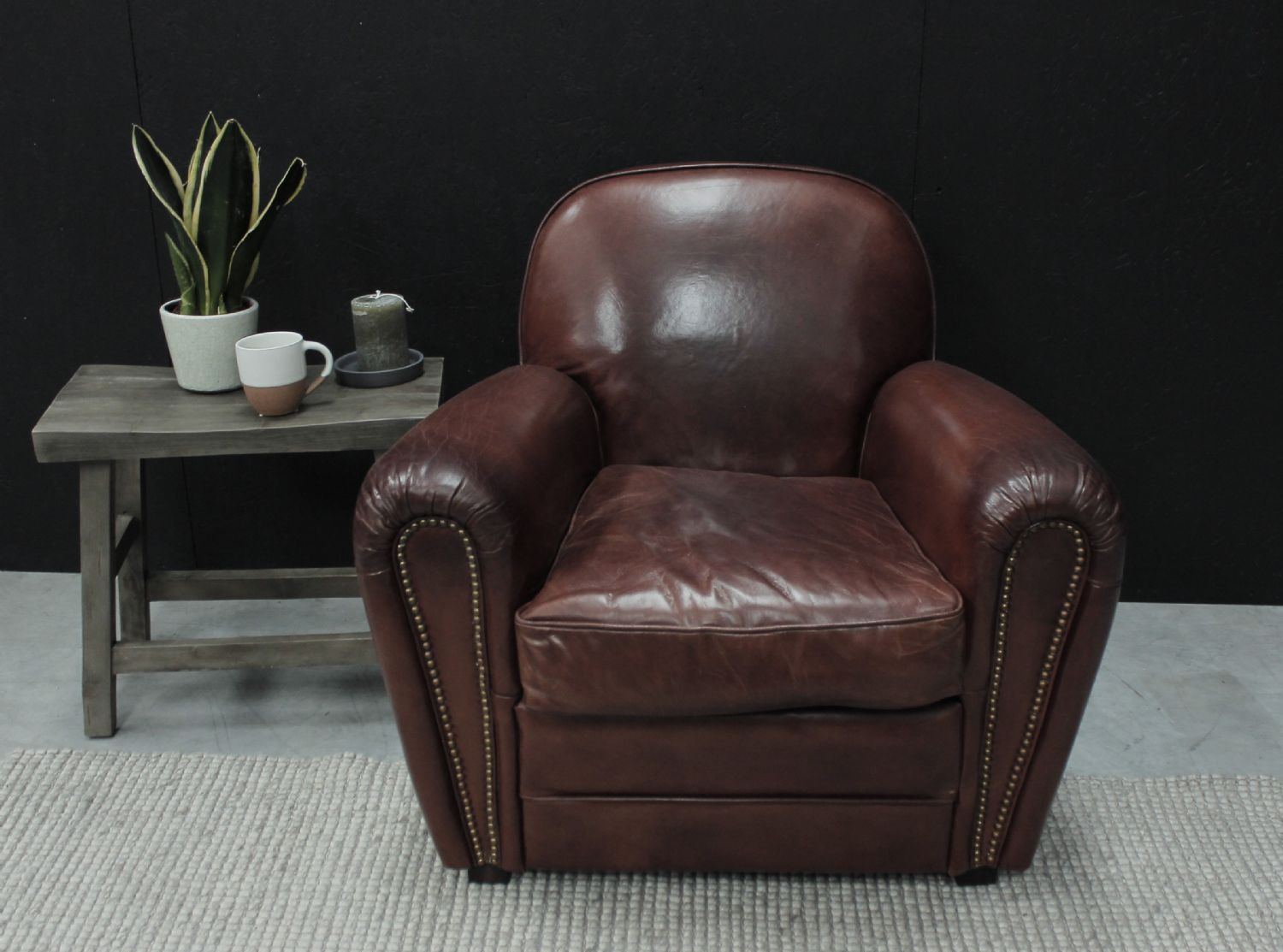 Vintage Brown Leather Upholstered Art Deco Armchair with Brass Stud Detailing - Home Furniture Interiors