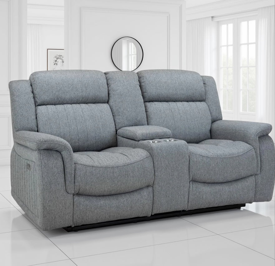 Gray reclining sofa in a room with white walls and a mirror.