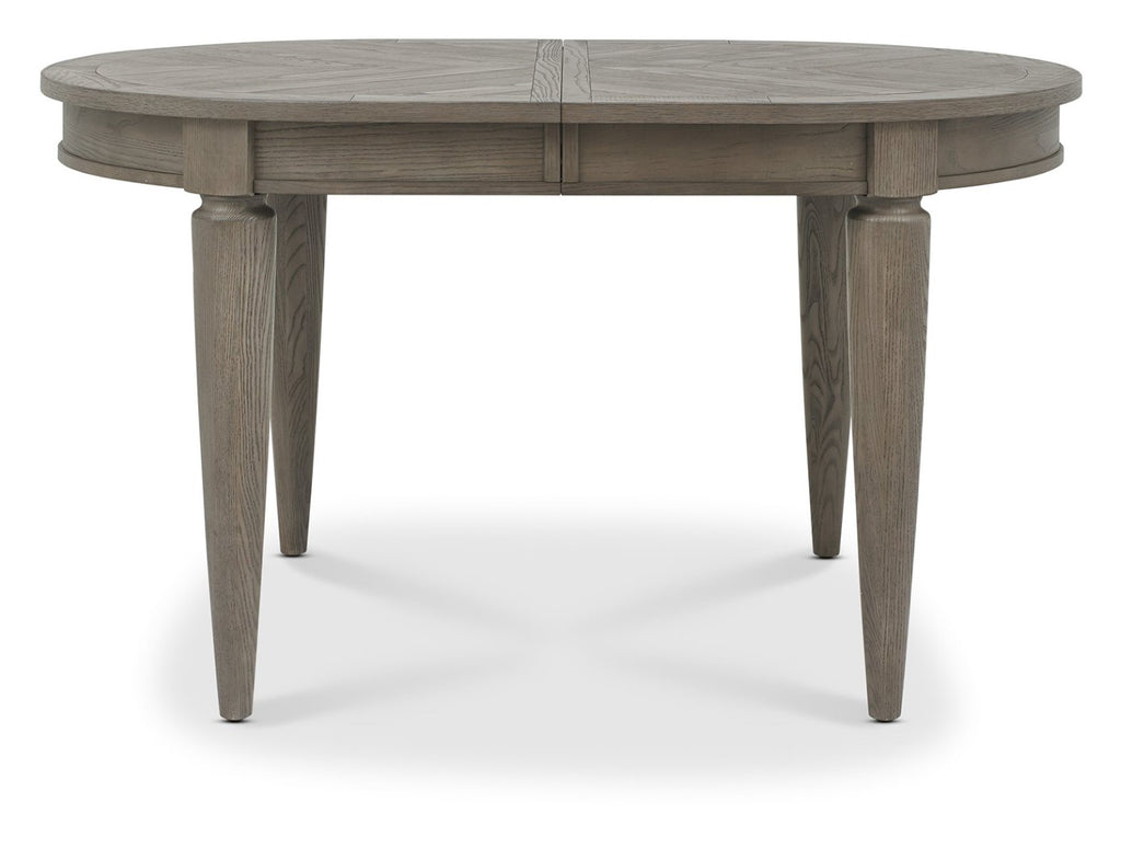 Silver grey wood oval extending dining table by Bentley Designs, showcasing its sleek surface and elegant design.