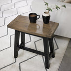 Weathered dark oak Bentley Designs side lamp table with black legs, featuring a rustic finish and compact end table design.