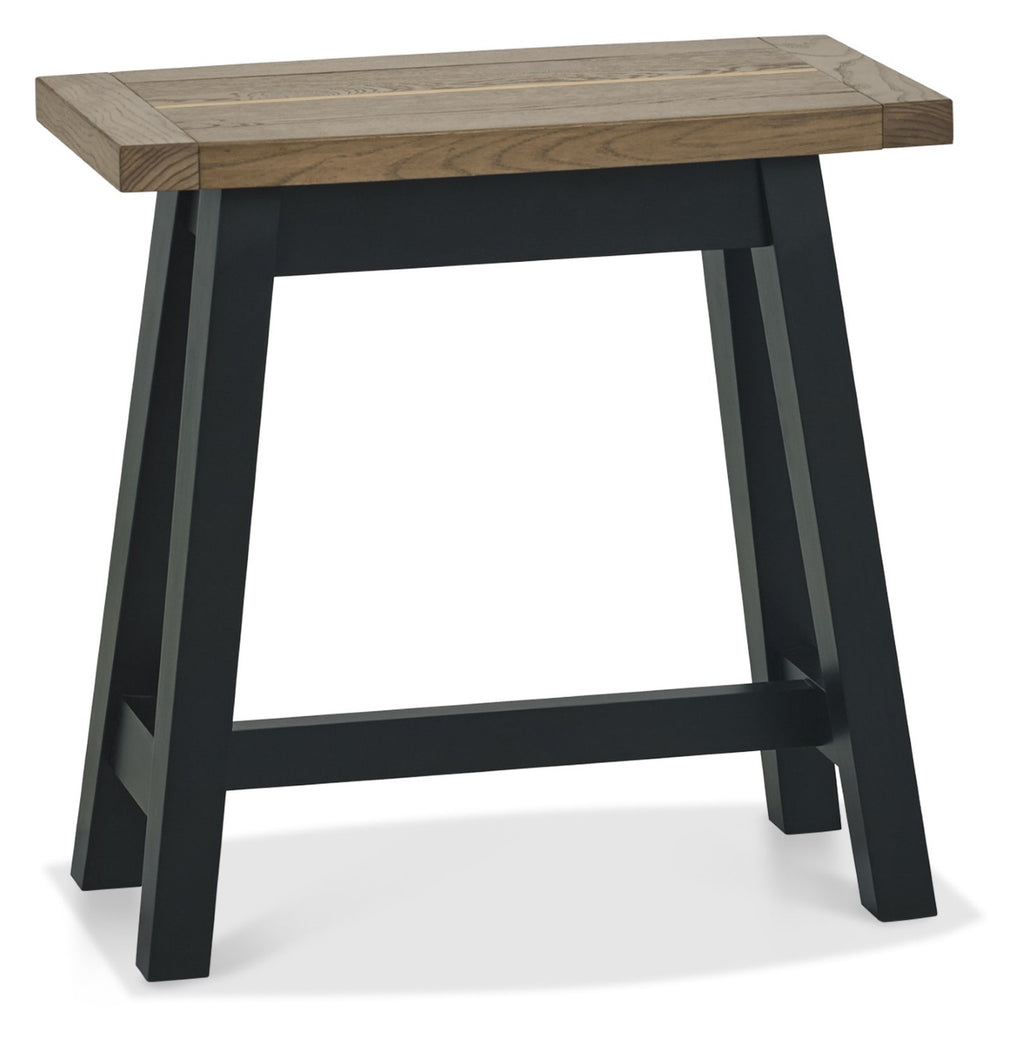 Weathered dark oak lamp table with black metal legs, side and end table from Bentley Designs, featuring a textured wood finish.