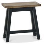 Weathered dark oak lamp table with black metal legs, side and end table from Bentley Designs, featuring a textured wood finish.