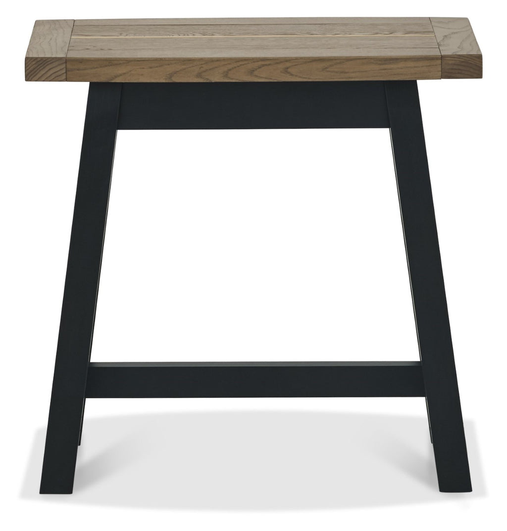 Weathered dark oak Bentley Designs side lamp and end table with black metal legs, featuring a rustic finish and compact design.