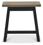 Weathered dark oak Bentley Designs side lamp and end table with black metal legs, featuring a rustic finish and compact design.