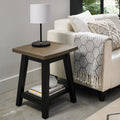 Weathered oak square side lamp table with black peppercorn base by Bentley Designs, showing the textured wood surface and sturdy legs.