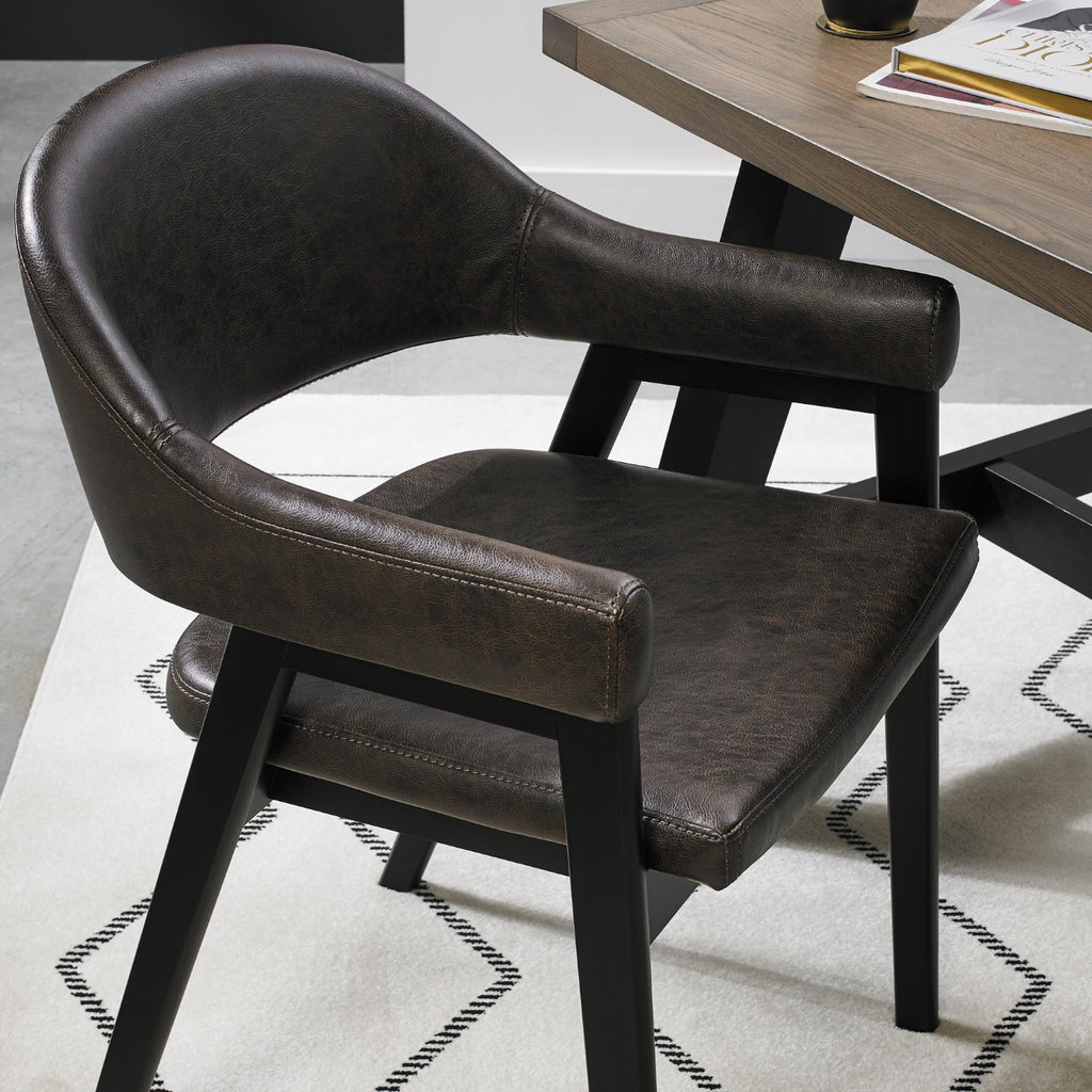 Vintage brown leather Bentley Designs dining arm chair with black legs, featuring classic upholstery and elegant wooden details.