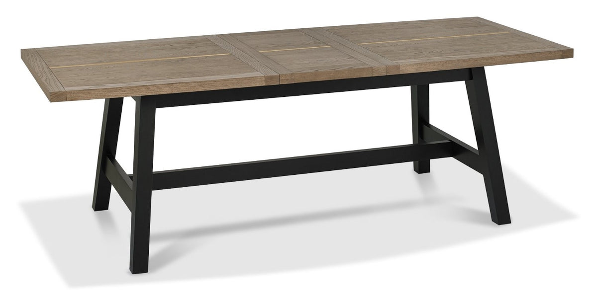 Weathered Oak dining table set with two grey fabric chairs and one matching bench by Bentley Designs.