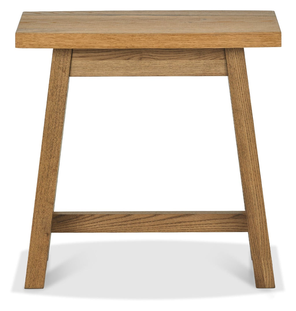 Rustic oak side table by Bentley Designs with a traditional style, featuring a smooth wooden surface and sturdy legs.