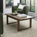 Dark oak Bentley Designs coffee table with wire brushed finish, featuring a sleek, modern wooden surface and sturdy legs.